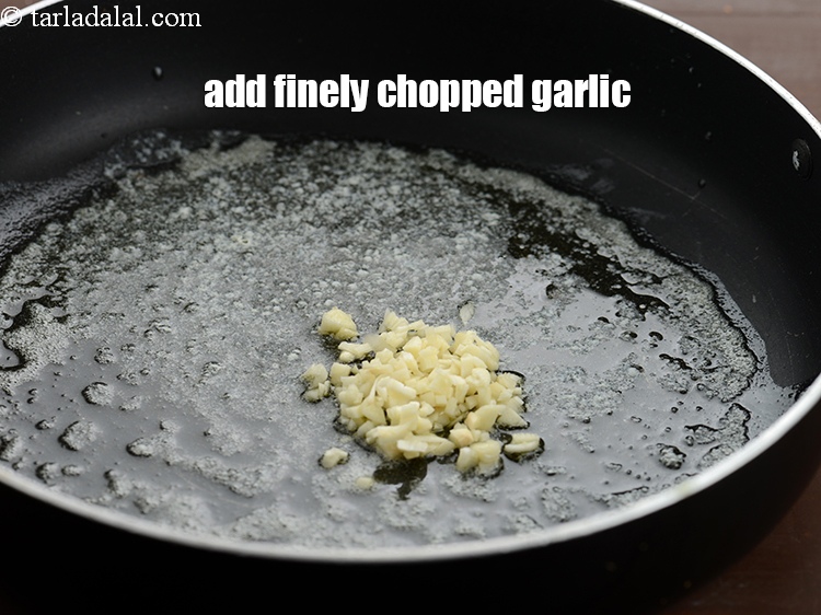 Step 7 – Add 2 tsp finely&nbsp;<a href="https://www.tarladalal.com/glossary-chopped-garlic-790i">chopped garlic (lehsun)</a>.
