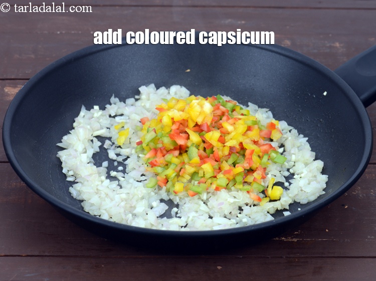 Step 7 – Add 1/2 cup&nbsp;finely&nbsp;<a href="https://tarladalal.com/glossary-chopped-coloured-capsicum-2800i">chopped coloured capsicum</a>.&nbsp;