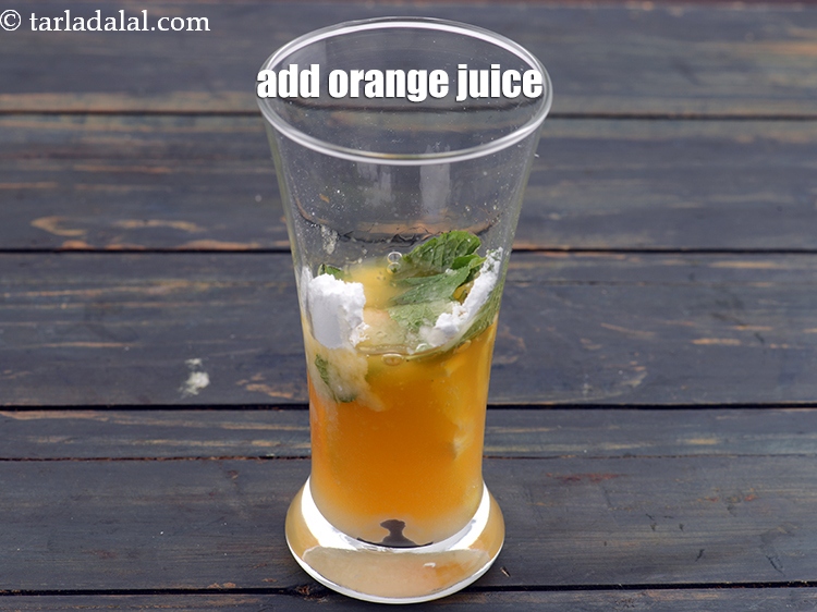 Step 7 – Add &frac14; th cup <a href="https://www.tarladalal.com/glossary-orange-juice-santre-ka-ras-narangi-ka-juice-118i">orange juice</a>.
