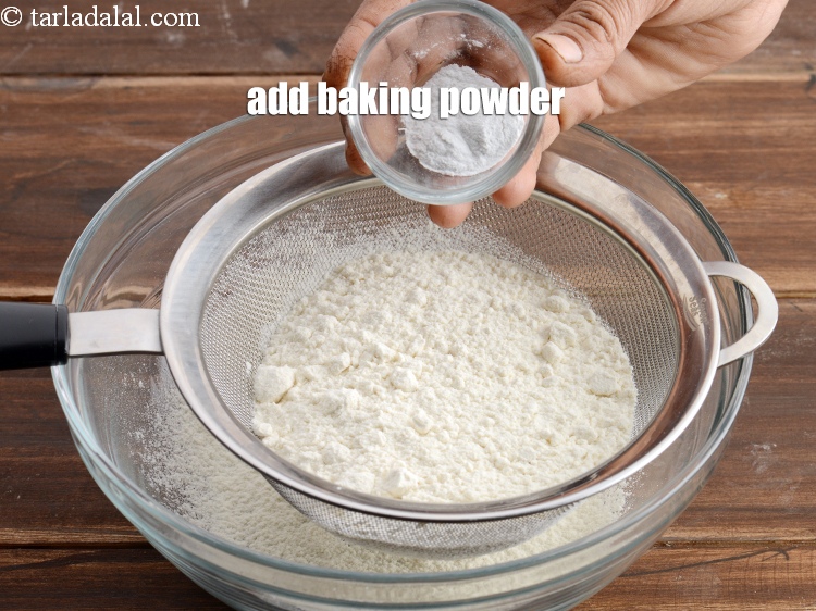 Step 9 – Add &frac12; tsp <a href="https://www.tarladalal.com/glossary-baking-powder-425i">baking powder</a>.