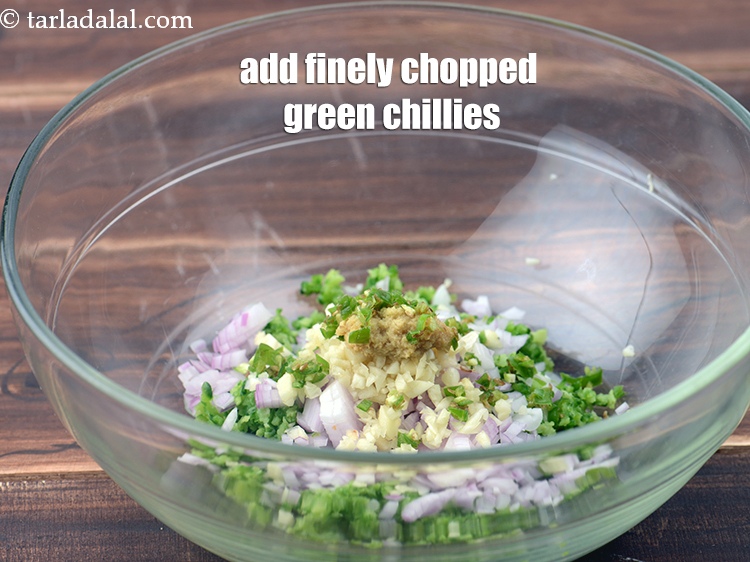 Step 7 – Add 1 tsp finely <a href="https://www.tarladalal.com/glossary-chopped-green-chilli-820i">chopped green chillies</a>.