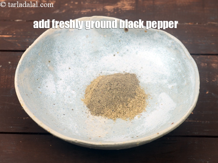 Step 8 – Add 2 tsp <a href="https://www.tarladalal.com/glossary-freshly-ground-black-pepper-kalimirch-powder-kali-mirch-ka-powder-567i">freshly ground black pepper (kalimirch)</a>.