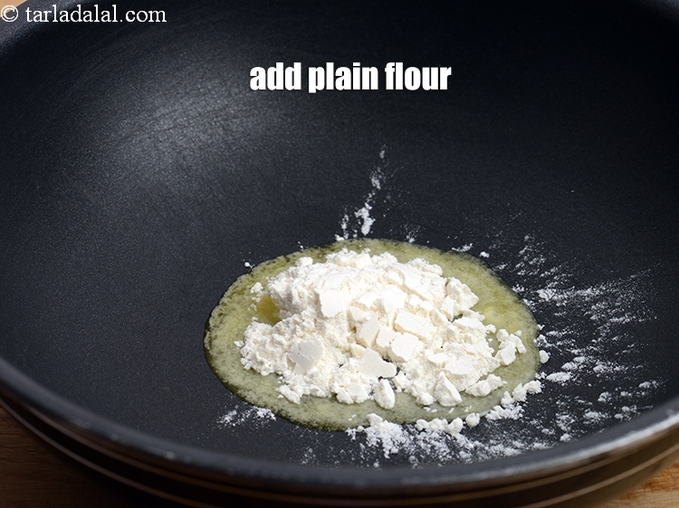 Step 10 – Add 1 tbsp <a href="https://www.tarladalal.com/glossary-plain-flour-maida-188i">plain flour (maida)</a>.