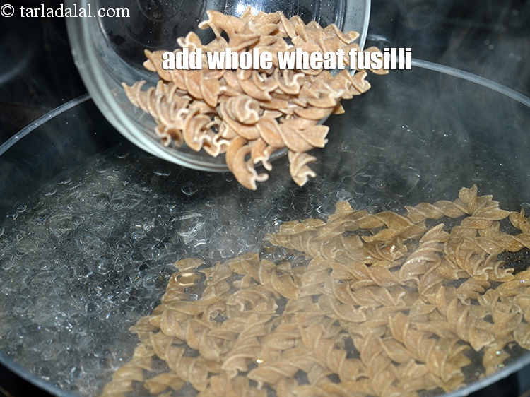 Step 7 – Add 1 cup&nbsp;whole wheat&nbsp;<a href="https://tarladalal.com/glossary-fusilli-helix-shaped-pasta-spiral-pasta-574i">fusilli</a>.&nbsp;