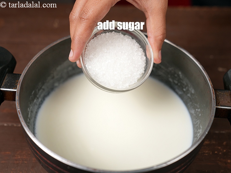 Step 7 – Add &frac14; cup <a href="https://www.tarladalal.com/glossary-sugar-chini-shakkar-278i">sugar</a>.
