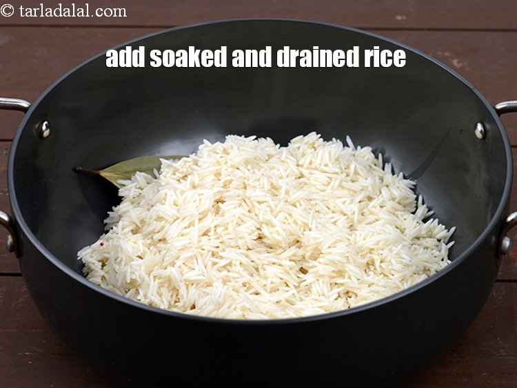 Step 9 – Add 1&frac14; cups <a href="https://www.tarladalal.com/glossary-rice-chawal-533i">rice (chawal)</a>&nbsp;, soaked and drained. We have soaked the rice for …