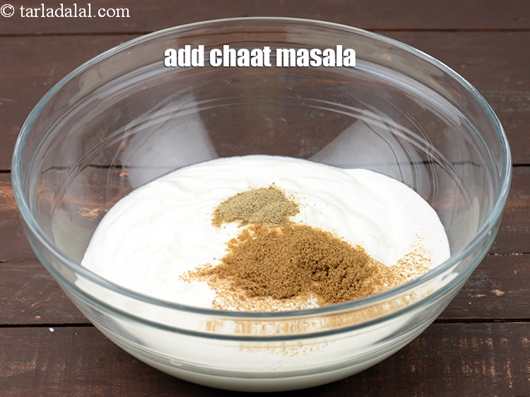 Step 11 – Add &frac12; tsp <a href="https://www.tarladalal.com/glossary-chaat-masala-300i">chaat masala</a>. It gives a chatpata flavour to the raita.