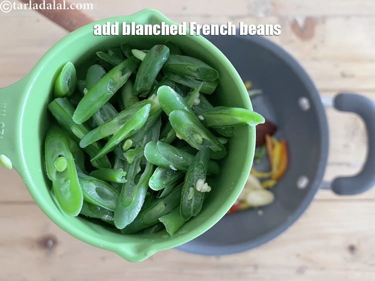 Step 10 – Add&nbsp;<meta charset="UTF-8" />1/4 cup&nbsp;<a href="glossary-diagonally-cut-and-blanched-french-beans-2439i">diagonally cut and blanched french beans</a>.