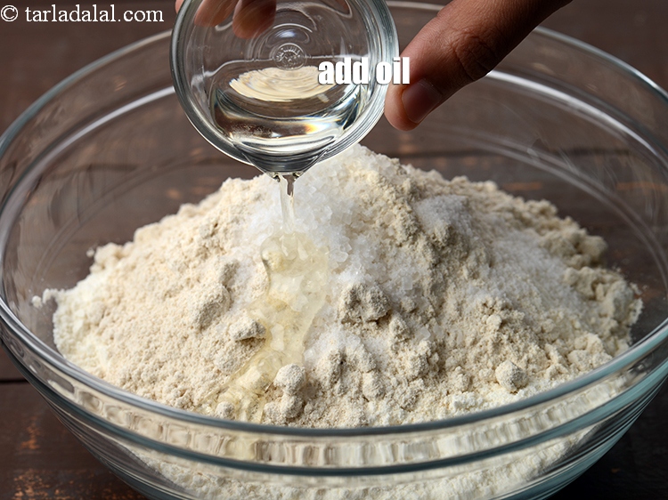 Step 8 – Add 2 tsp <a href="https://www.tarladalal.com/glossary-oil-671i">oil</a>.