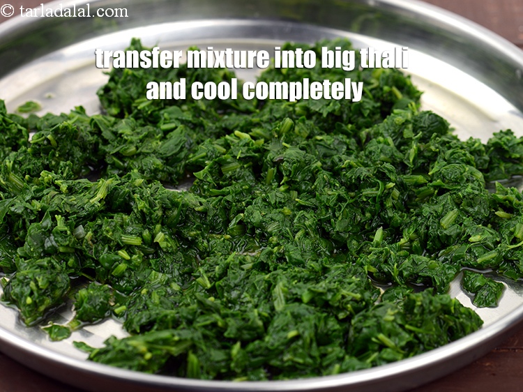 Step 7 – Transfer the mixture into big thali and cool completely.