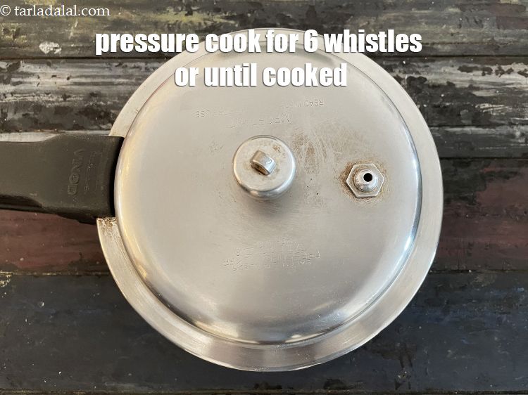 Step 14 – Pressure cook for 6 to 7 whistles or till cooked.
