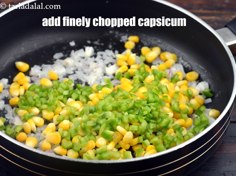 Step 7 – Add 1/4 cup&nbsp;finely&nbsp;<a href="https://www.tarladalal.com/glossary-chopped-capsicum-164i">chopped green capsicum</a>