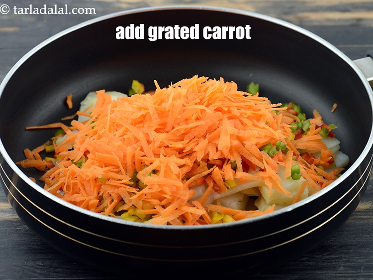 Step 7 – Add 1/2 cup&nbsp;<a href="https://www.tarladalal.com/glossary-grated-carrot-816i">grated carrot</a>.