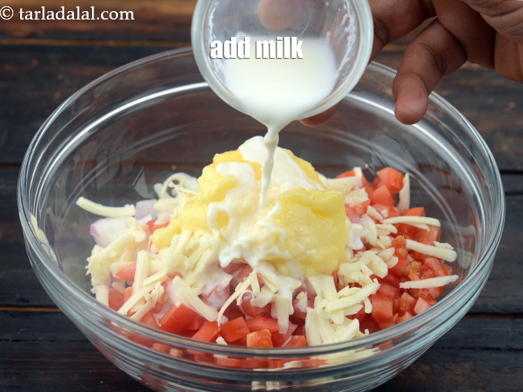 Step 7 – Add 2 tsp&nbsp;<a href="https://www.tarladalal.com/glossary-milk-doodh-full-cream-milk-514i">milk</a>.&nbsp;