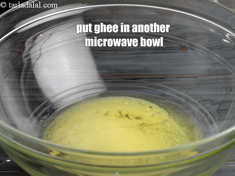 Step 7 – Put &frac14; cup <a href="https://www.tarladalal.com/glossary-ghee-245i">ghee</a> in another microwave safe bowl.