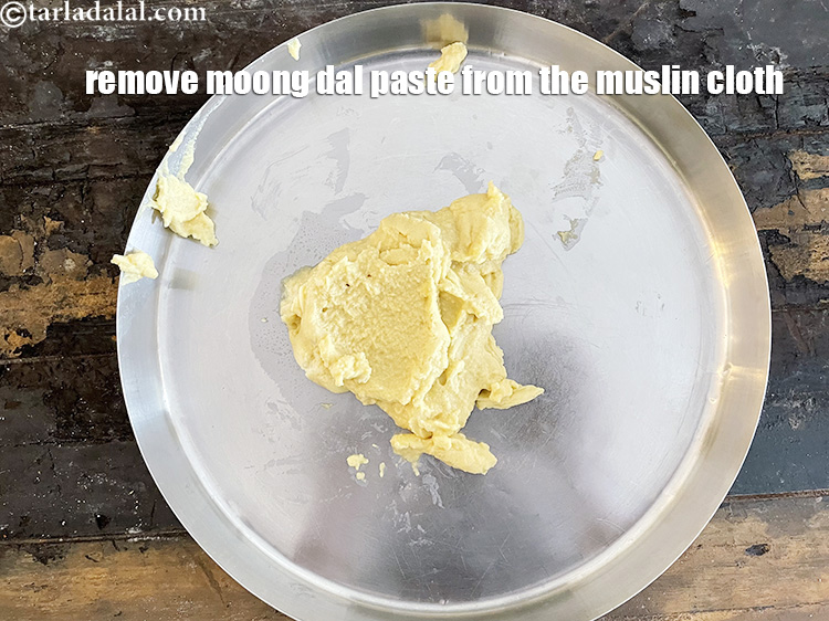 Step 14 – Remove the moong dal paste from the muslin cloth into a plate.