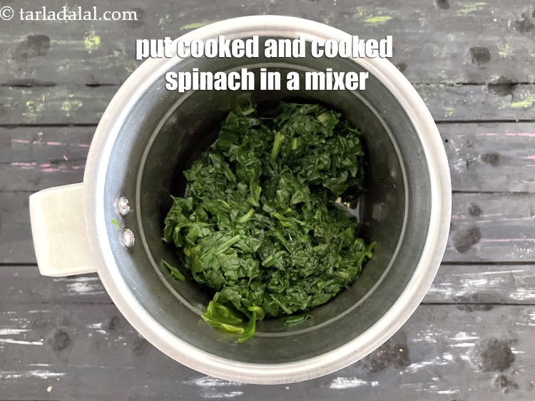 Step 10 – In a mixer, put the cooked spinach.