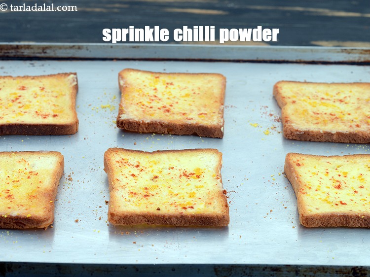 Step 7 – Sprinkle little <a href="https://www.tarladalal.com/glossary-chilli-powder-red-chilli-powder-339i">chilli powder</a>&nbsp; evenly over it.&nbsp;