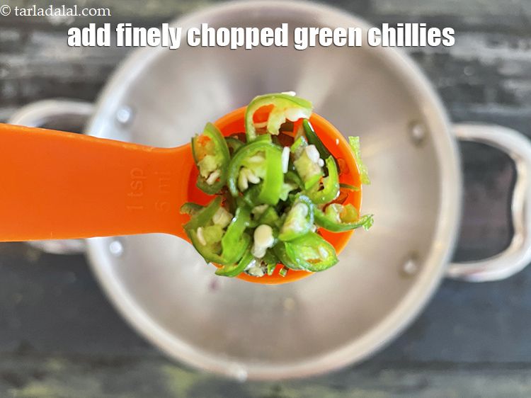 Step 9 – Add 1&nbsp;tsp&nbsp;finely&nbsp;<a href="https://tarladalal.com/glossary-chopped-green-chilli-820i">chopped green chillies</a>.