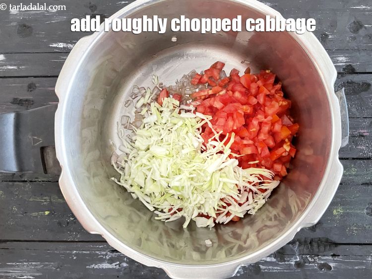 Step 10 – Add&nbsp;<meta charset="UTF-8" />1/2 cup&nbsp;roughly chopped&nbsp;<a href="glossary-cabbage-patta-gobi-kobi-248i">cabbage</a>.
