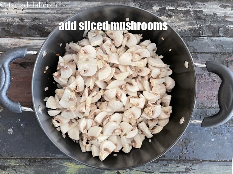 Step 21 – Add&nbsp;<meta charset="UTF-8" />3 1/4 cups&nbsp;<a href="glossary-mushrooms-khumb-dhingri-493i">mushrooms (khumbh)</a>&nbsp;, stem removed and sliced.