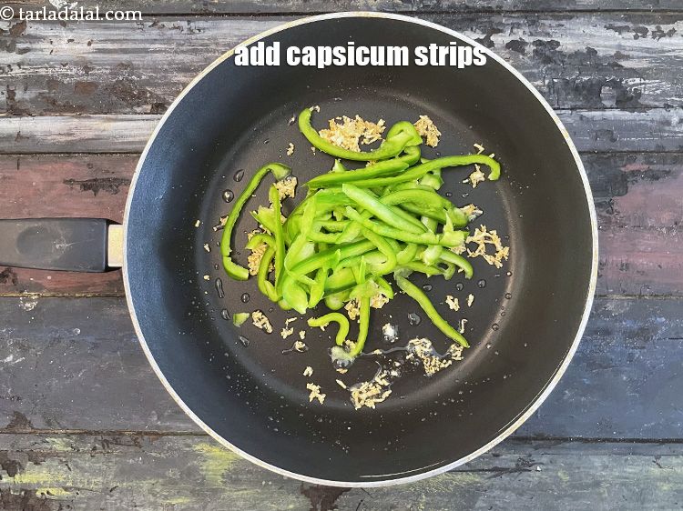 Step 13 – Add&nbsp;<meta charset="UTF-8" />1/2 cup&nbsp;<a href="glossary-capsicum-shimla-mirch-bell-pepper-163i">capsicum</a>&nbsp;, cut into thin strips.
