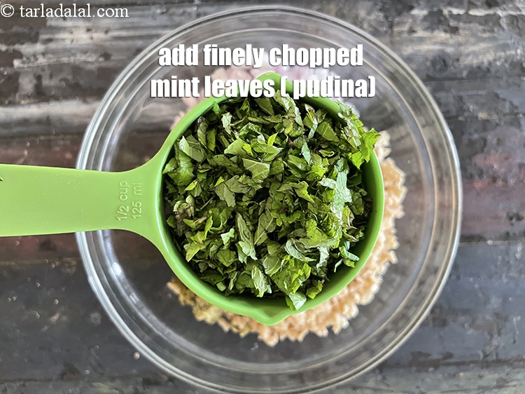 Step 22 – Add&nbsp;<meta charset="UTF-8" />1/2 cup&nbsp;finely&nbsp;chopped mint leaves (phudina).