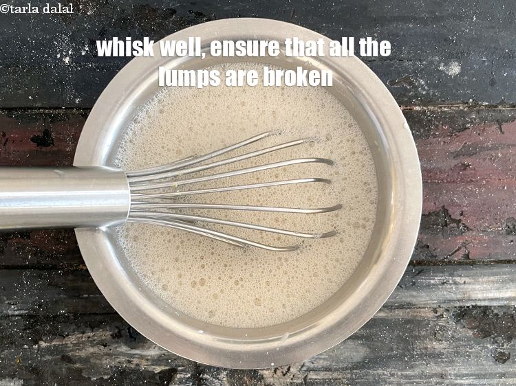 Step 14 – <meta charset="UTF-8" />Mix well with a whisk. Ensure that all the lumps of curd are …