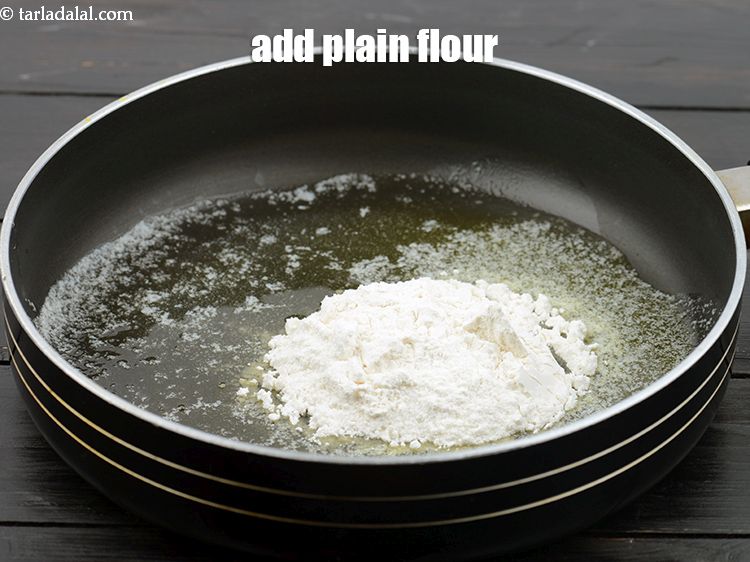 Step 8 – Add 2 1/2 tbsp&nbsp;<a href="https://www.tarladalal.com/glossary-plain-flour-maida-188i">plain flour (maida)</a>.&nbsp;