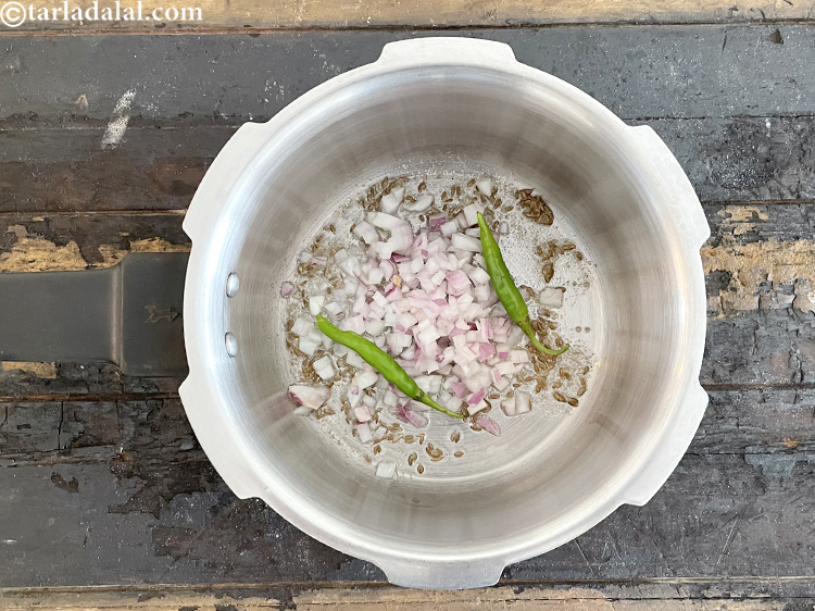 Step 23 – Add&nbsp;<meta charset="UTF-8" />2&nbsp;<a href="glossary-slit-green-chillies-1856i">slit green chillies</a>.&nbsp;Antioxidant&nbsp;<a href="https://www.tarladalal.com/recipes-for-Juices-Rich-in-Vitamin-C-805" target="_blank">vitamin C</a>&nbsp;in&nbsp;<a href="http://www.tarladalal.com/recipes-using-green-chillies-331">green chillies</a>&nbsp;protects the body from effects …