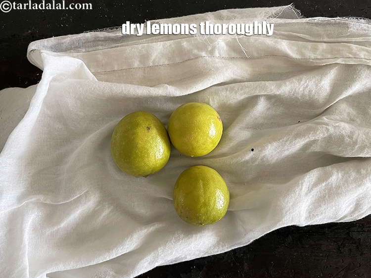 Step 22 – Remove the cooked hot lemons from the pan and dry them. This will prevent the …