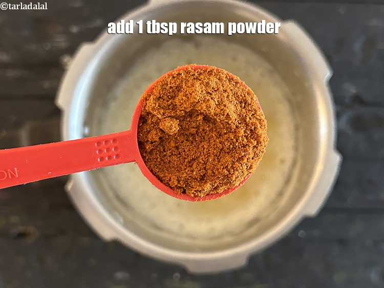 Step 10 – Add&nbsp;<strong>1 tbsp</strong> rasam powder.
