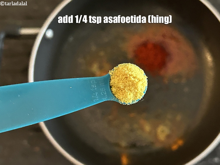 Step 9 – Add&nbsp;<meta charset="UTF-8" />1/4 tsp&nbsp;<a href="glossary-asafoetida-hing-113i">asafoetida (hing)</a>.
