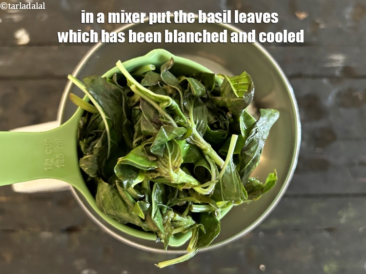 Step 9 – In a mixer put the basil leaves which has been blanched and cooled.