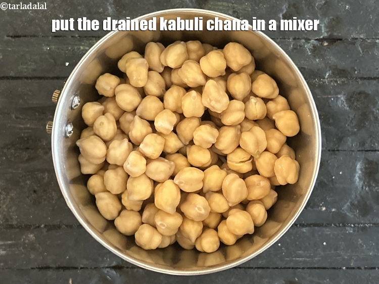 Step 8 – Put the drained kabuli chana in a mixer.