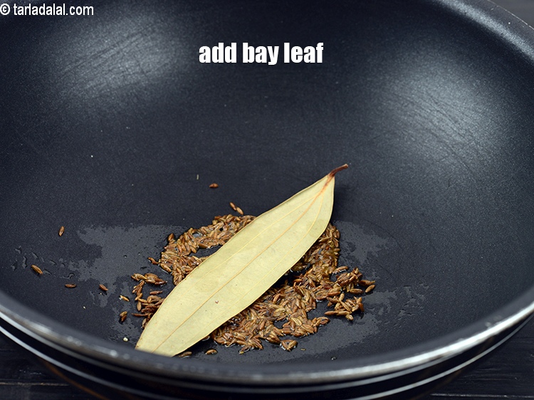 Step 8 – Once the seeds crackle, add 1 <a href="https://www.tarladalal.com/glossary-bay-leaf-tejpatta-bay-leaves-189i">bay leaf (tejpatta)</a>.