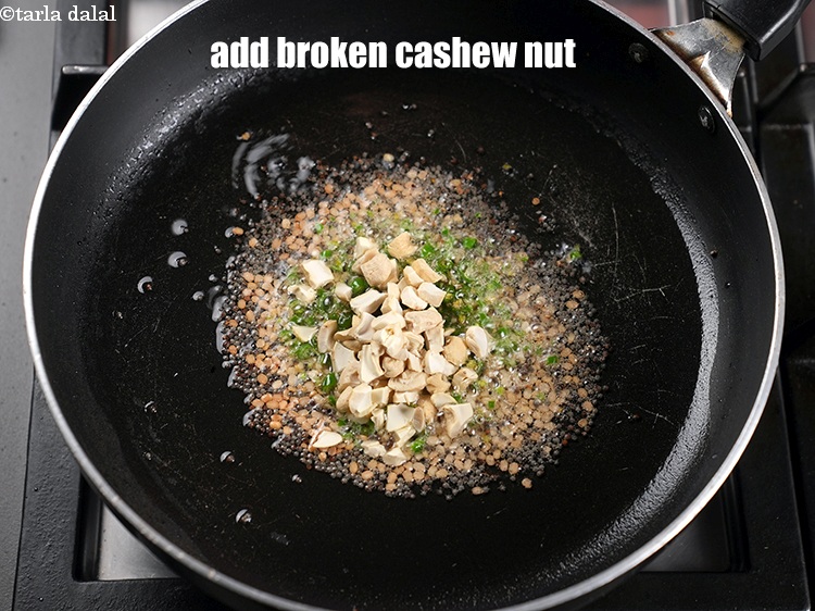 Step 13 – Add 1 tbsp <a href="https://www.tarladalal.com/glossary-broken-cashew-nut-906i">broken cashew nut (kaju)</a>.