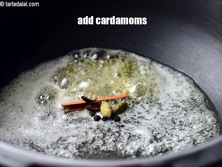 Step 8 – Add 2&nbsp;<a href="https://www.tarladalal.com/glossary-cardamom-elaichi-262i">cardamoms (elaichi)</a>.