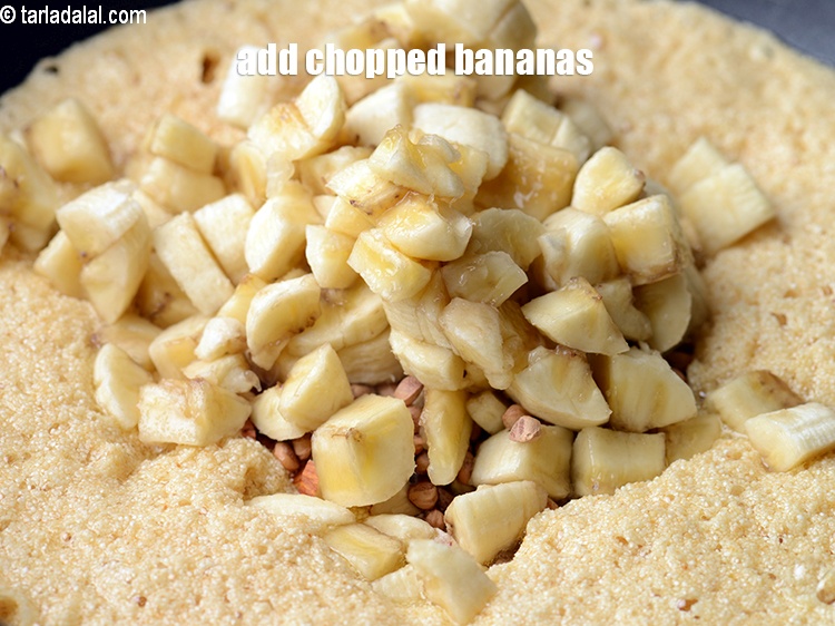 Step 8 – Add 1 cup <a href="https://www.tarladalal.com/glossary-chopped-bananas-20i">chopped bananas</a>.