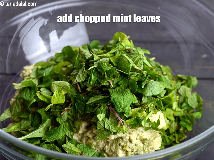 Step 8 – Add 3 tbsp <a href="https://www.tarladalal.com/glossary-chopped-mint-788i">chopped mint leaves (phudina)</a>.&nbsp;