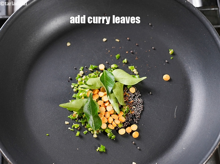 Step 8 – Add 8 to 10 <a href="https://www.tarladalal.com/glossary-curry-leaves-kadi-patta-kadipatta-388i">curry leaves (kadi patta)</a>.&nbsp;