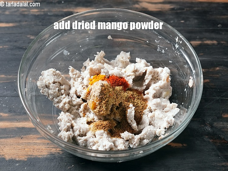 Step 8 – Add 1/4 tsp <a href="https://www.tarladalal.com/glossary-dried-mango-powder-amchur-powder-148i">dried mango powder (amchur)</a>.