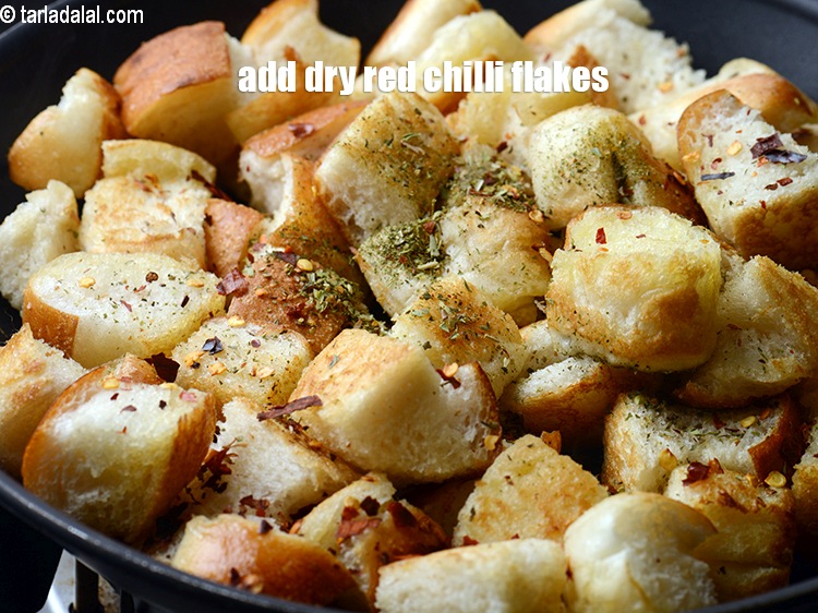 Step 9 – Add &frac12; tsp <a href="https://www.tarladalal.com/glossary-dry-red-chilli-flakes-paprika-338i">dry red chilli flakes (paprika)</a>.