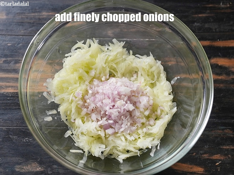 Step 8 – Add &frac12; cup finely <a href="https://www.tarladalal.com/glossary-chopped-onions-722i">chopped onions</a>.&nbsp;
