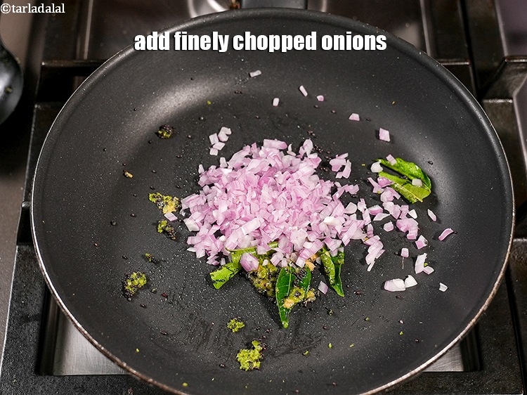 Step 8 – Add &frac14; tsp finely <a href="https://www.tarladalal.com/glossary-chopped-onions-722i">chopped onions</a>.