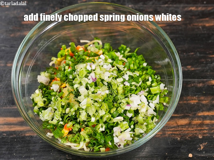 Step 8 – Add &frac14; cup finely <a href="https://www.tarladalal.com/glossary-chopped-spring-onion-whites-815i">chopped spring onions whites</a>.