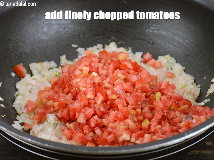 Step 8 – Add 1 cup finely <a href="https://www.tarladalal.com/glossary-chopped-tomatoes-779i">chopped tomatoes</a>.