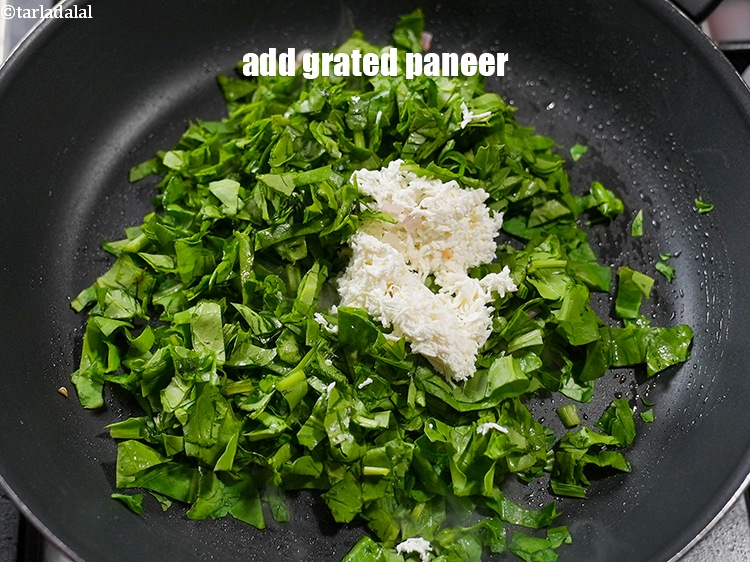 Step 8 – Add &frac12; cup <a href="https://www.tarladalal.com/glossary-grated-panee-1003i">grated paneer (cottage cheese)</a>.