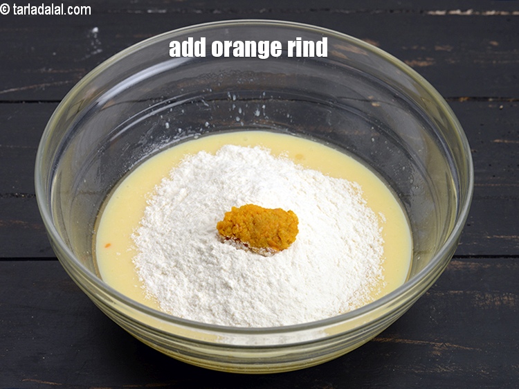 Step 9 – Add 1 tsp <a href="https://www.tarladalal.com/glossary-orange-rind-119i">orange rind</a>.