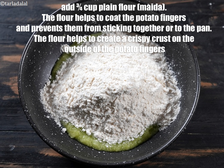 Step 28 – Add &frac34; cup <a href="https://www.tarladalal.com/glossary-plain-flour-maida-188i">plain flour (maida)</a>.&nbsp;The flour helps to coat the potato fingers and …
